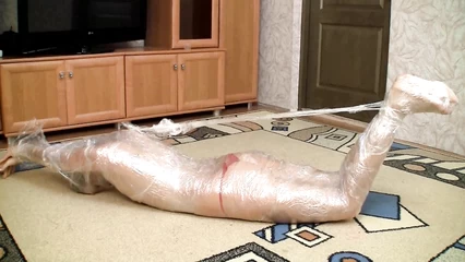 Связанная рабыня пытается вырваться