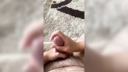 Дрочит хуй  и массирует яйца